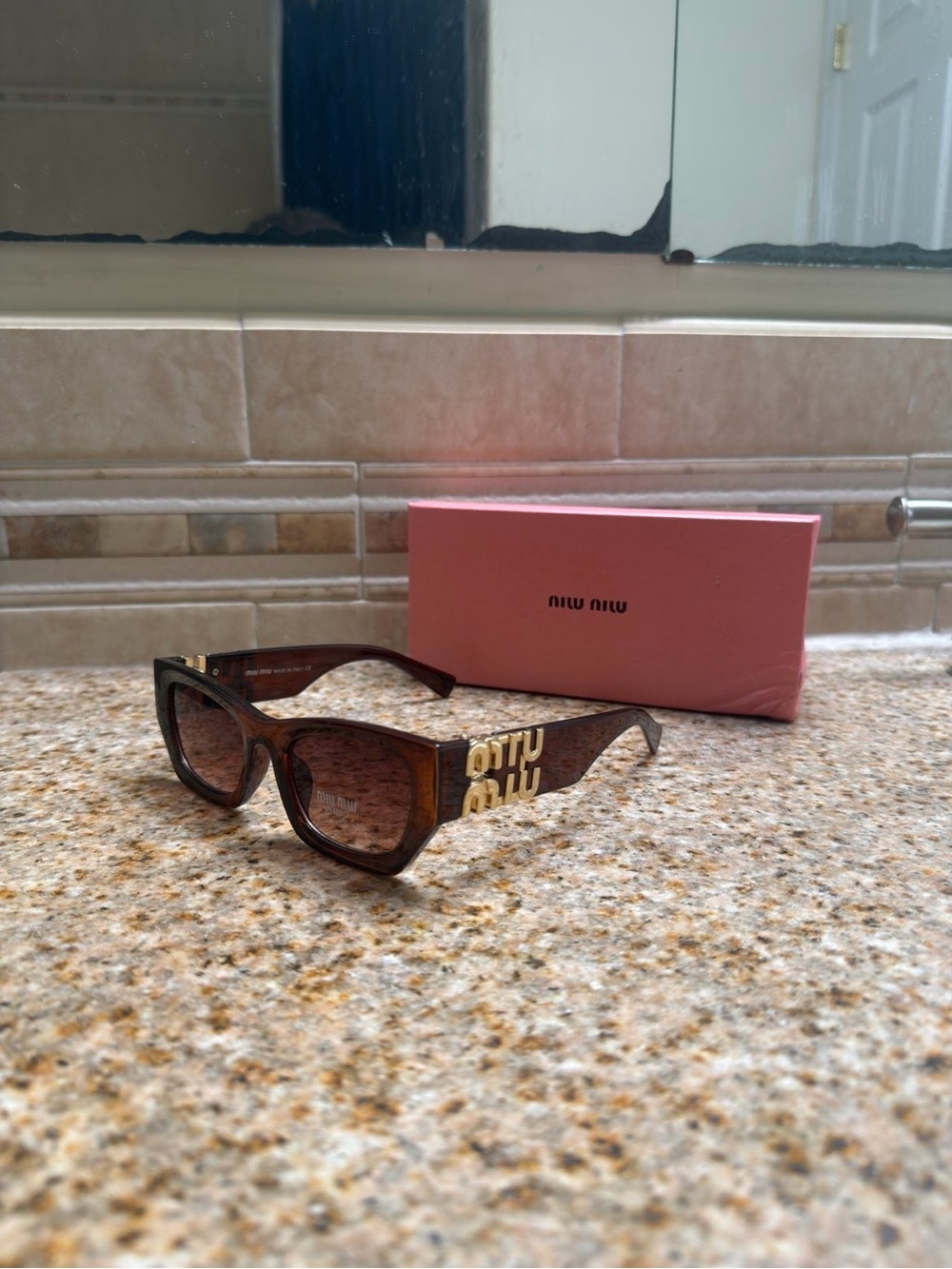 Miu Miu Brown Tortoiseshell Sunglasses with Gold Logo Accents